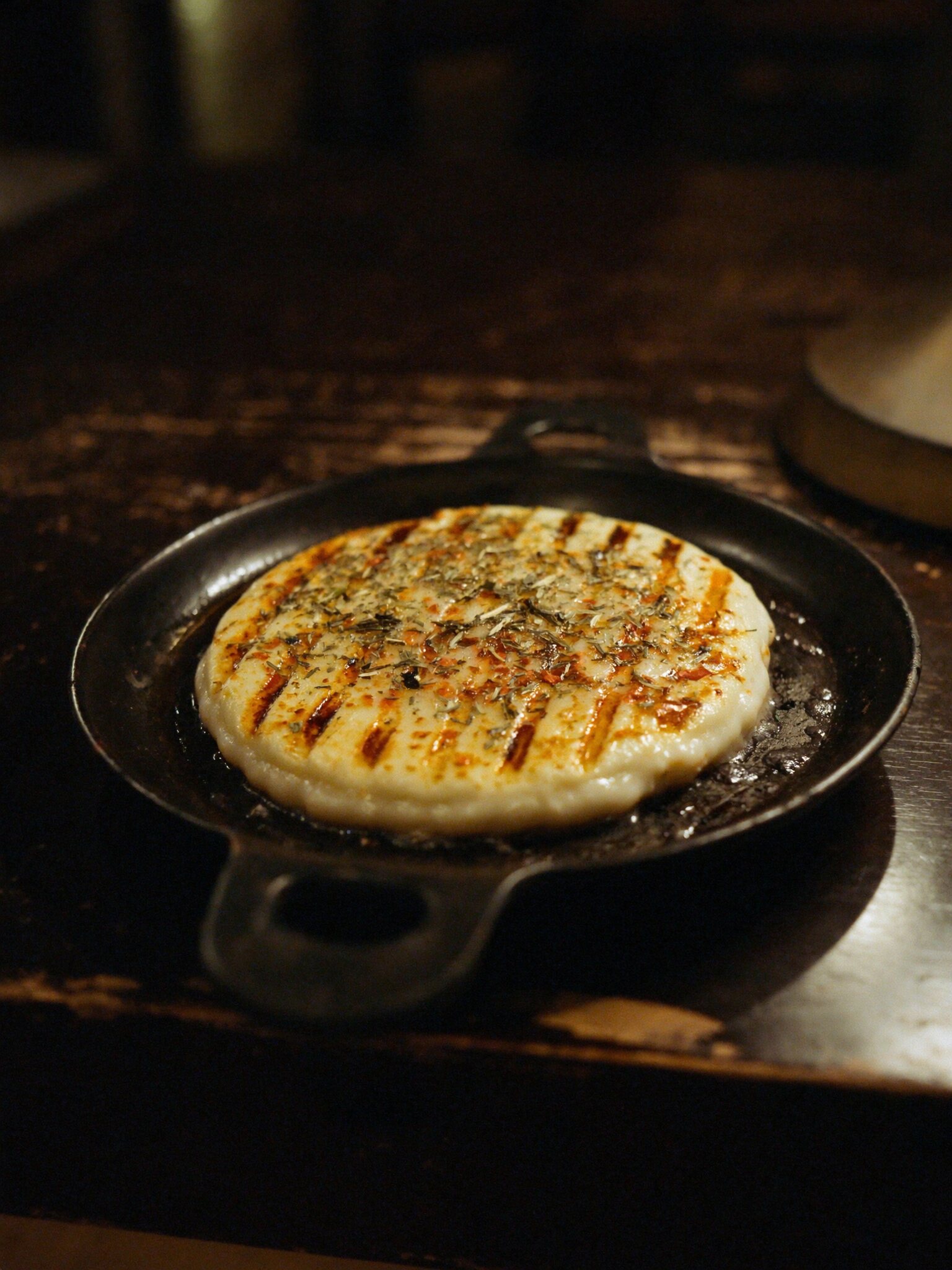Provoleta at a parrilla table